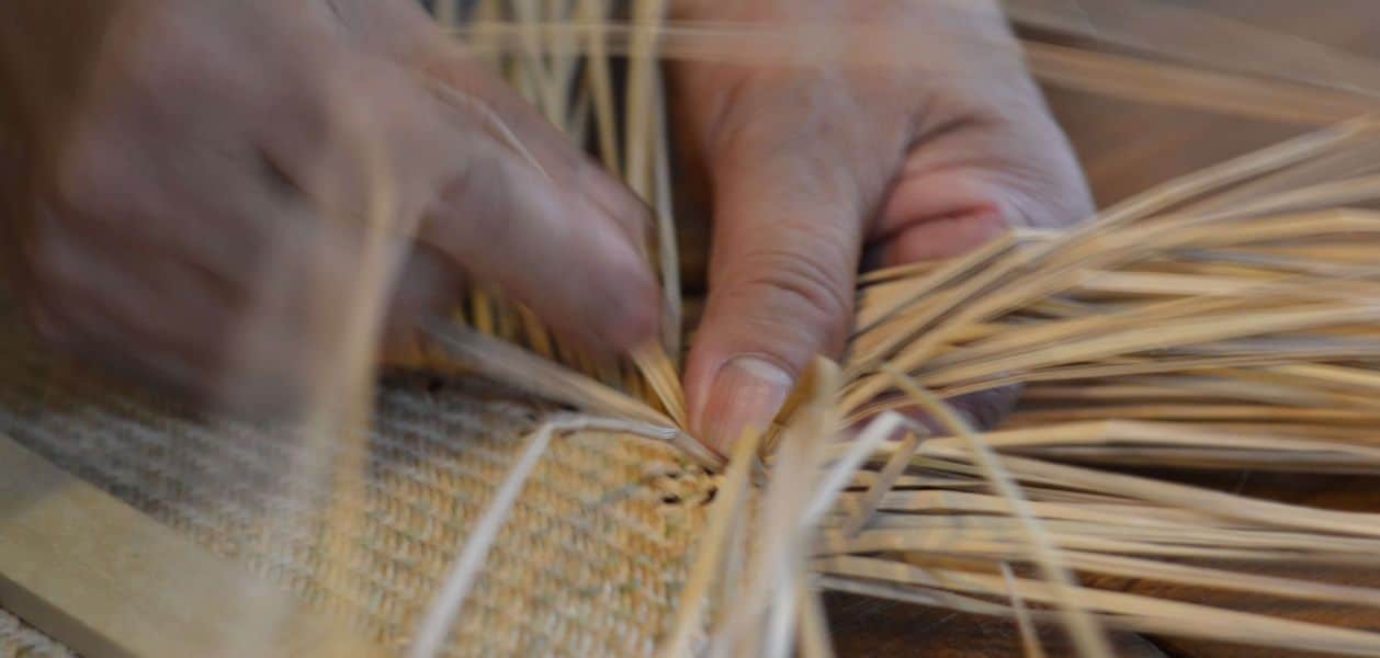 Person creating basket